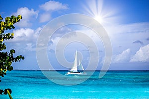 A sailboat out on a beautiful ocean view