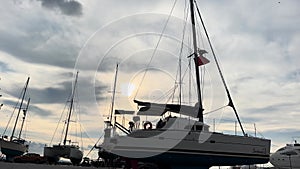 Sailboat out of the water getting repaired 4 k video winter dusk