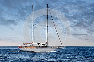 Sailboat in the plain sea sailing between the Lavezzi islands