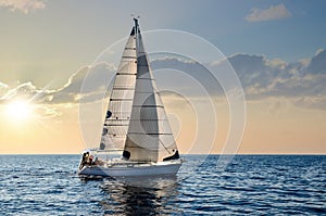 Sailboat in the plain sea sailing between the Lavezzi islands