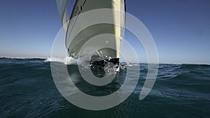 Sailboat prow sailing closeup in super slow motion, loopable