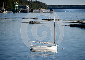 Sailboat in quaint and rural fishing village