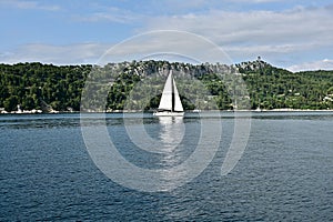 Sailboat Sailing Along the Croatian Shoreline of the Adriatic Sea