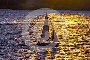 A sailboat sailing along the East River.