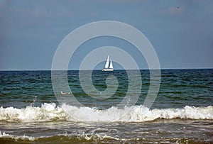 Sailboat sailing on blue sea