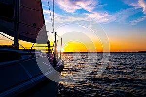 Sailboat sailing in the Mediterranean Sea at sunset photo