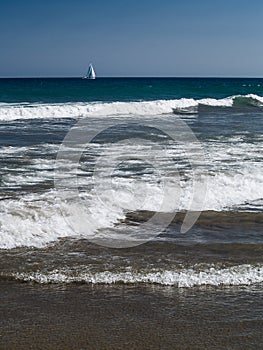 Sailboat sailing through the ocean photo