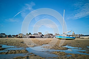 Sailboat on the sand at low tide, village of the Croisic on Guerande peninsula France