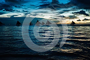 Sailboat in the sea and beautiful sunset at Boracay island, Philippines