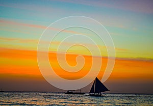 Sailboat on the sea horizon at sunset background pearl