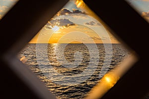 Sailboat sunset framed window view