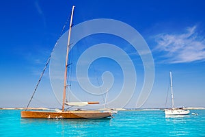 Sailboat in turquoise beach of Formentera