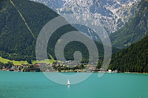 Sailboat on the turquoise waters of Achensee, Tirol, Austria