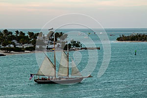 A sailboat at twilight off the coast of Key West