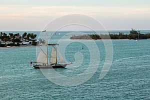 A sailboat at twilight off the coast of Key West