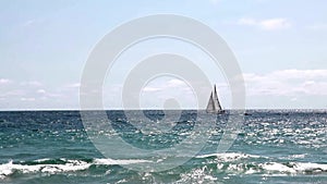 Sailboat Under Sail On Ocean Cloudy Sky