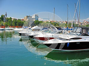 Sailboat and Yacht anchored in the small port Tomis photo