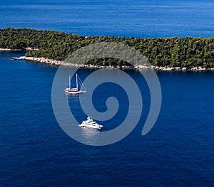 Sailboat and yatch beside Lokrum island in Dubrovnik Mediterranean coast, Croatia