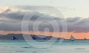 Sailboats against sunset on Boracay island