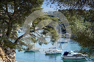 Sailboats anchored in the natural harbour of Port-Miou in southeast France