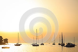 Sailboats anchored at sunset in Adriatic sea