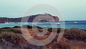 Sailboats in bay, Cape Sounion Temple, Greece