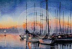 Sailboats in bay at sunset