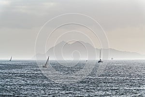 Sailboats and Cies Islands in Galicia at dusk, Spain