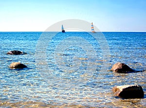 Sailboats in Clear Blue Water with Blue Sky