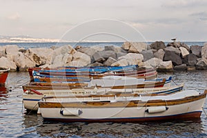 Sailboats in dock of Mediterranean sea. Boats in harbour in Naples Napoli, Italy. Sailing and travel concept.