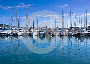 Sailboats docked in the port of the city of Ibiza