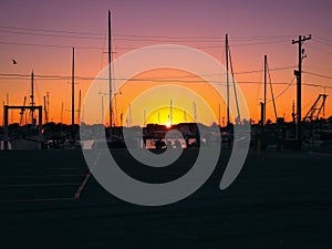 Sailboats and Golfcart in Sunset photo