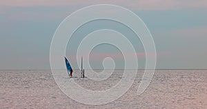 Sailboats on the Horizon at Dusk