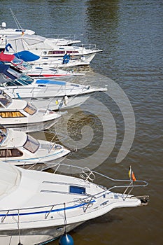 Sailboats lined up in a line