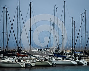 Sailboats in a marina with a storm rolling in on Lake Michigan