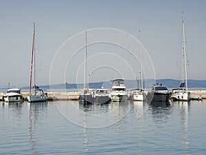 Sailboats moored at the marina of Baska Voda, Croatia. Yachts and boats in the Adriatic Sea