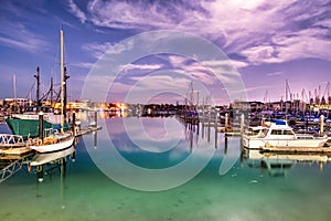 Sailboats moored on a peaceful bay at night, long exposure, Australia