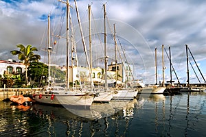 Sailboats in the nice little town Mogan on Gran Ca photo