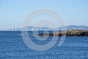 Sailboats in Palma bay and horizon on a sunny day