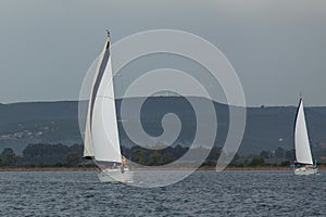 Sailboats participate in sailing regatta among Greek island group in the Aegean Sea, in Cyclades and Argo-Saronic Gulf.