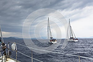 Sailboats participate in sailing regatta 12th Ellada Autumn 2014 among Greek island group in the Aegean Sea