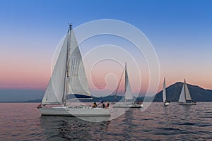 Sailboats participate in sailing regatta 12th Ellada Autumn 2014 among Greek island group in the Aegean Sea