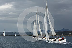 Sailboats participate in sailing regatta 12th Ellada Autumn 2014 among Greek island group in the Aegean Sea