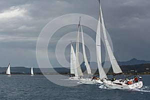 Sailboats participate in sailing regatta 12th Ellada Autumn 2014 among Greek island group in the Aegean Sea