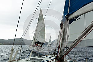 Sailboats participate in sailing regatta 12th Ellada Autumn 2014 among Greek island group in the Aegean Sea