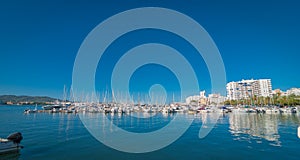 Sailboats & pleasure craft moored. Morning in the harbor of Sant Antoni de Portmany, Ibiza town, Balearic Islands, Spain.