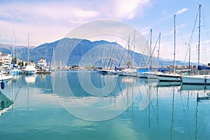 Sailboats reflected on sea Kalamata port Greece