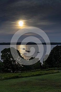 Sailboats at Rest Under the Moon