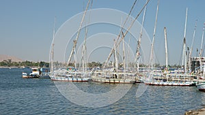 Sailboats, ships, yachts swaying on river Nile waves