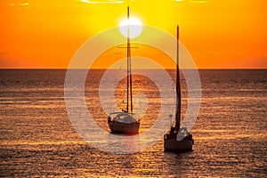 Sailboats at sunset